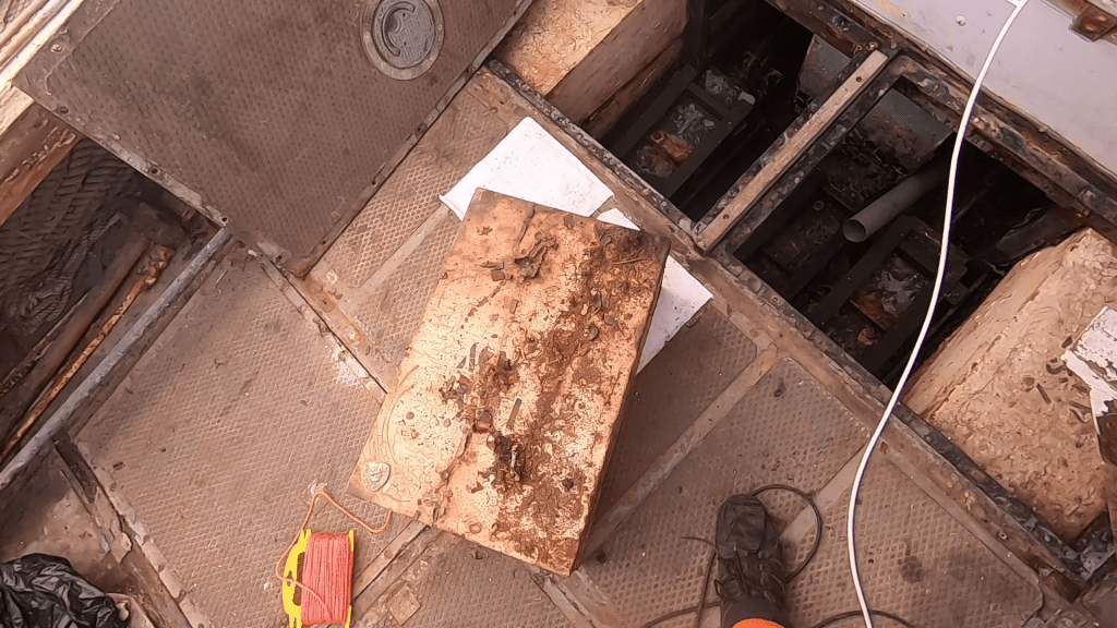 Buoyancy box resting on a cluttered boat deck